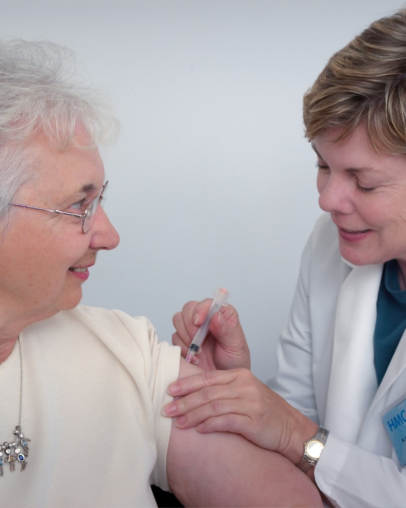 A TrueNest caregiver supporting a resident with Alzheimer's in our intimate home setting in Harrisburg, NC